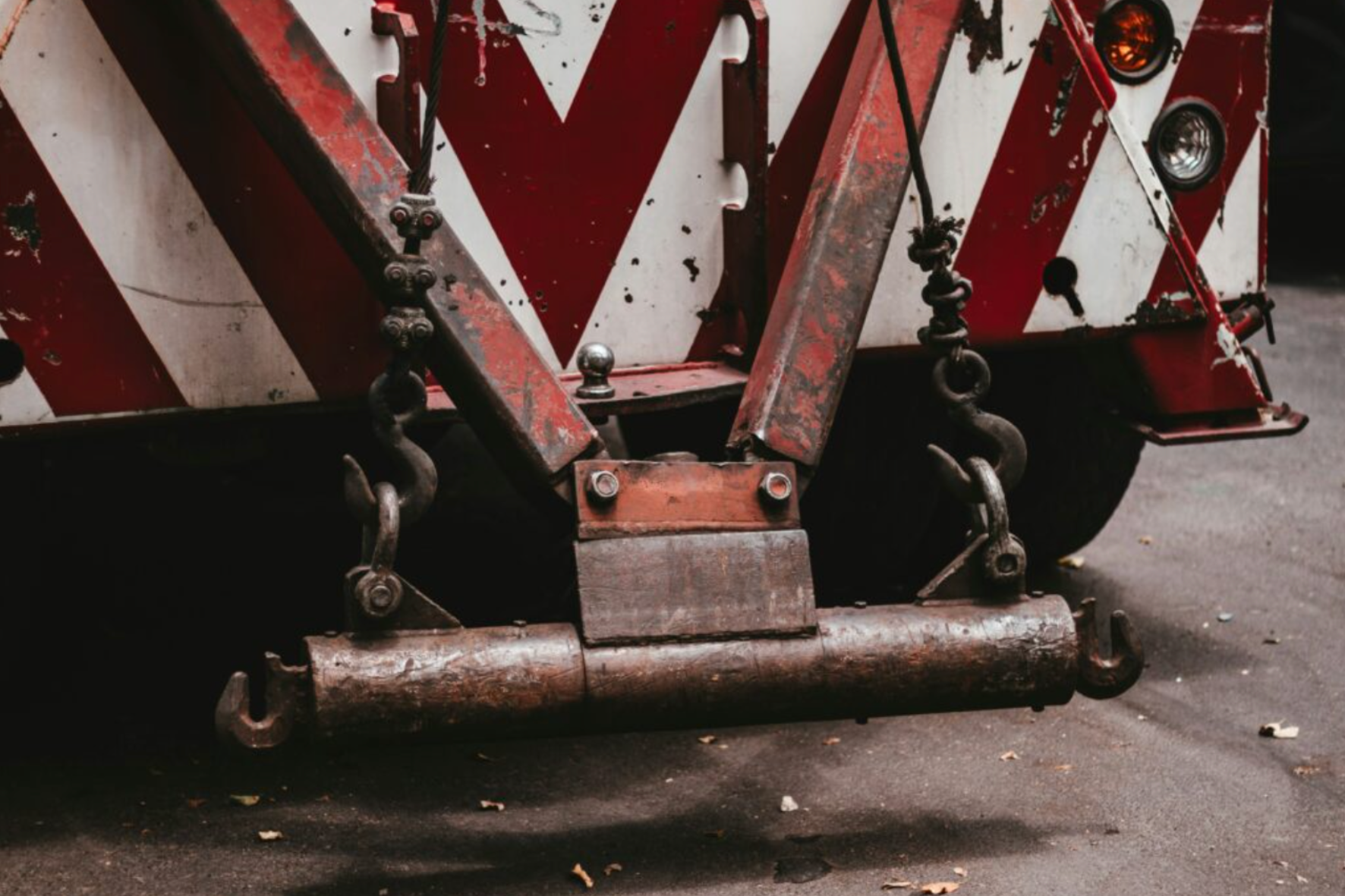 A close up of a tow truck with a hook for towing.