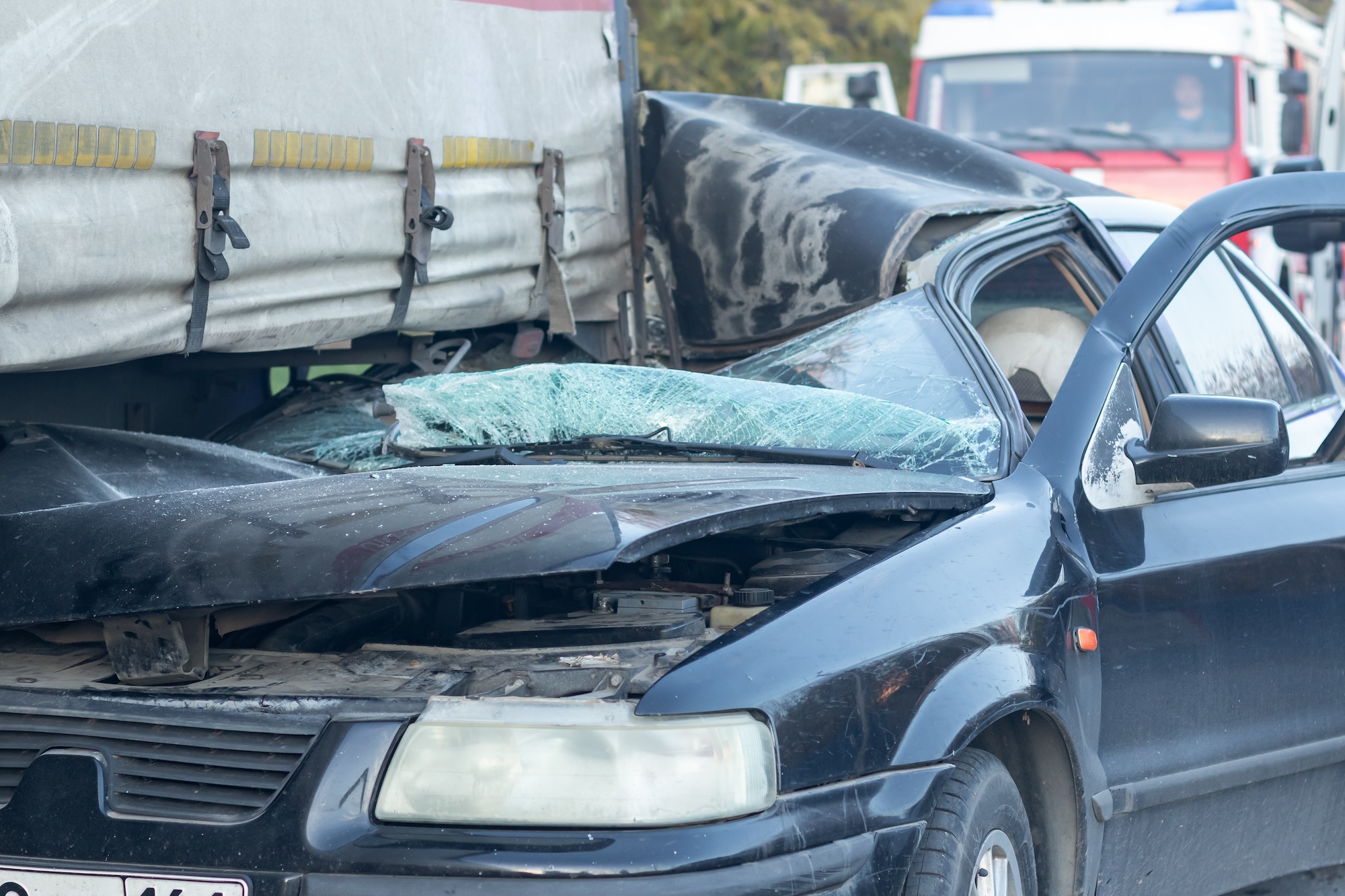 Wrecker services responding to a heavily damaged vehicle after a collision in Nashville.